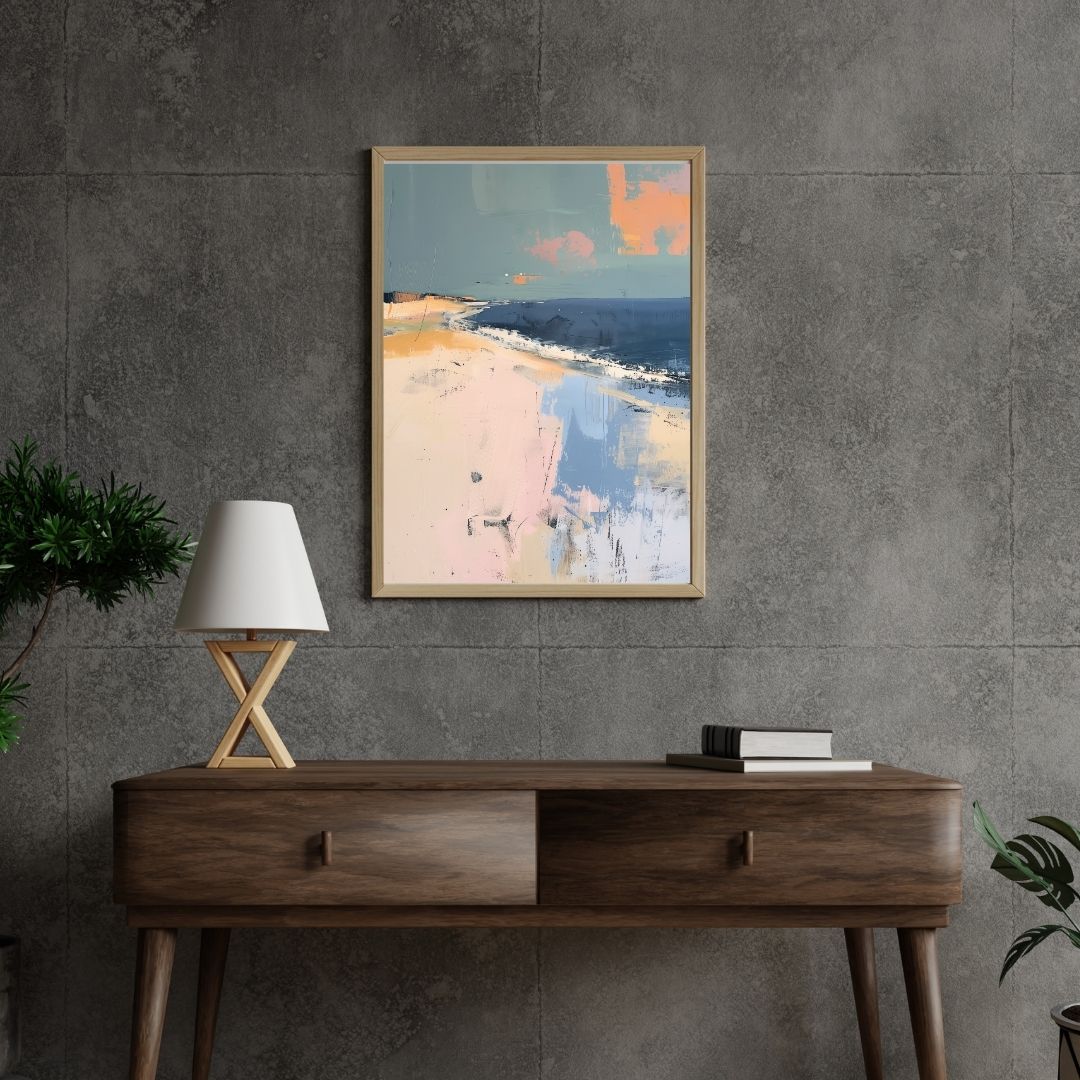 Framed abstract art on a gray wall above a wooden console table with a lamp.