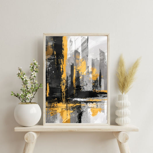Framed abstract art with yellow and black colors on a white shelf with decorative plants.