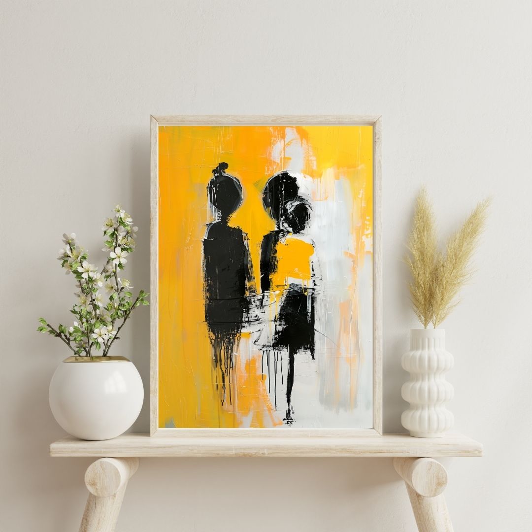 Framed abstract art with black and white figures on a yellow background, displayed on a shelf with decorative plants.