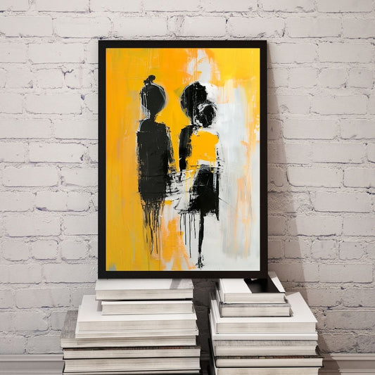 Abstract art print with black and white figures on a yellow background, framed and leaning against a white brick wall.