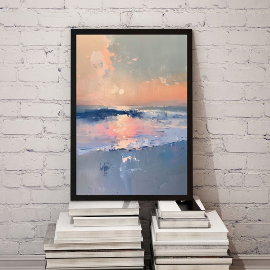 Framed artwork of a sunset over water on a stack of books against a white brick wall.