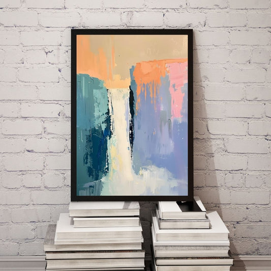 Abstract painting in a black frame on a stack of books against a white brick wall.
