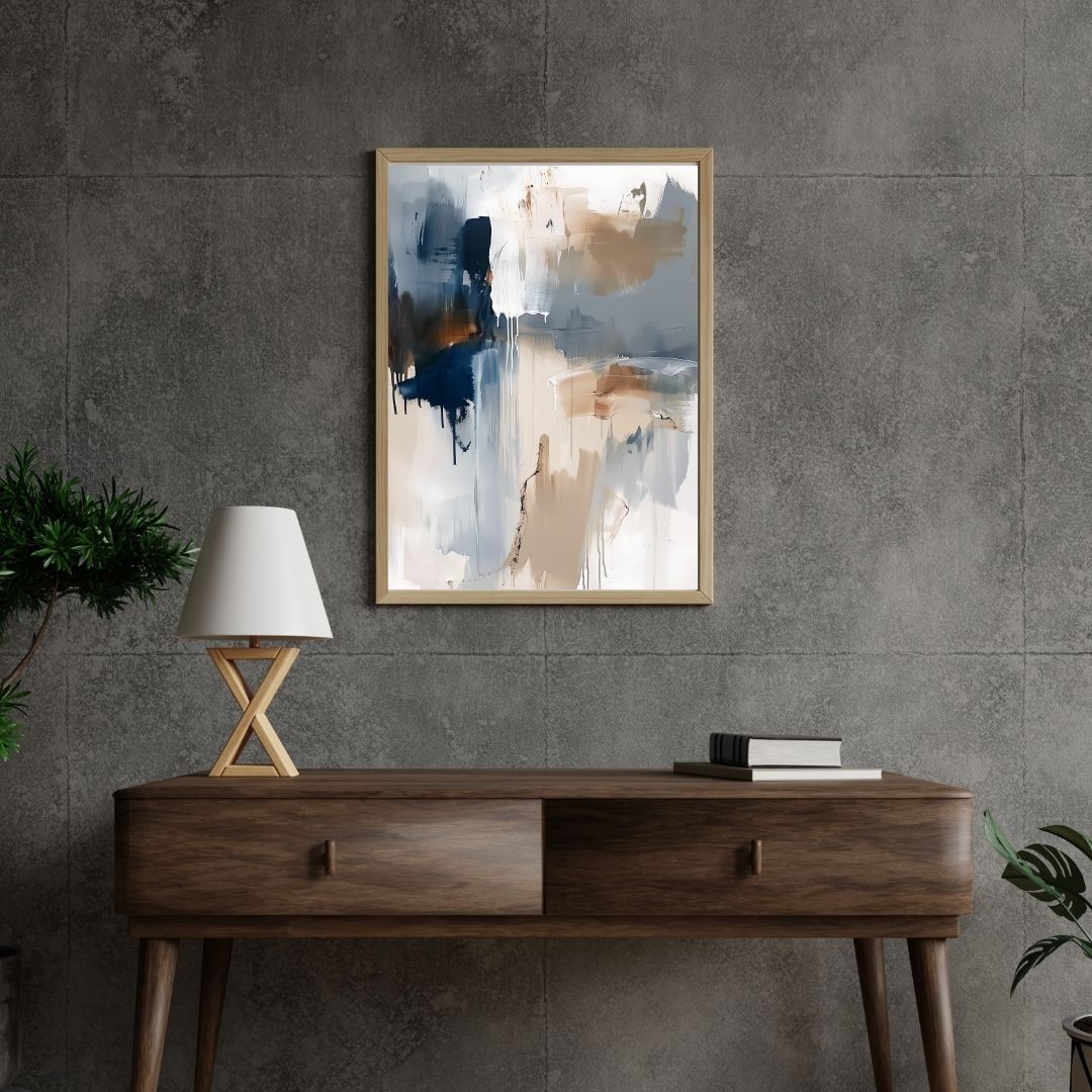 Abstract painting on a gray wall above a wooden console table with a lamp and books.