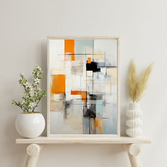 Abstract art piece in a wooden frame on a shelf with decorative plants.