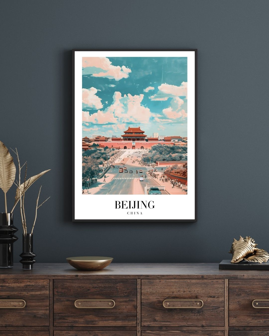 Framed poster of Beijing with a scenic view on a dark wall above a wooden cabinet.