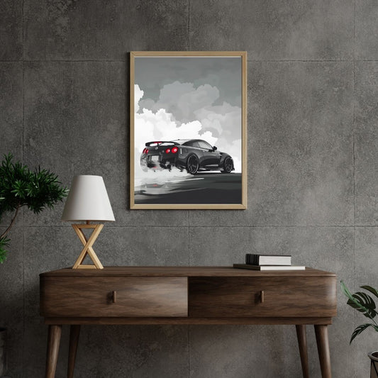 Framed artwork of a black sports car on a gray wall above a wooden console table.