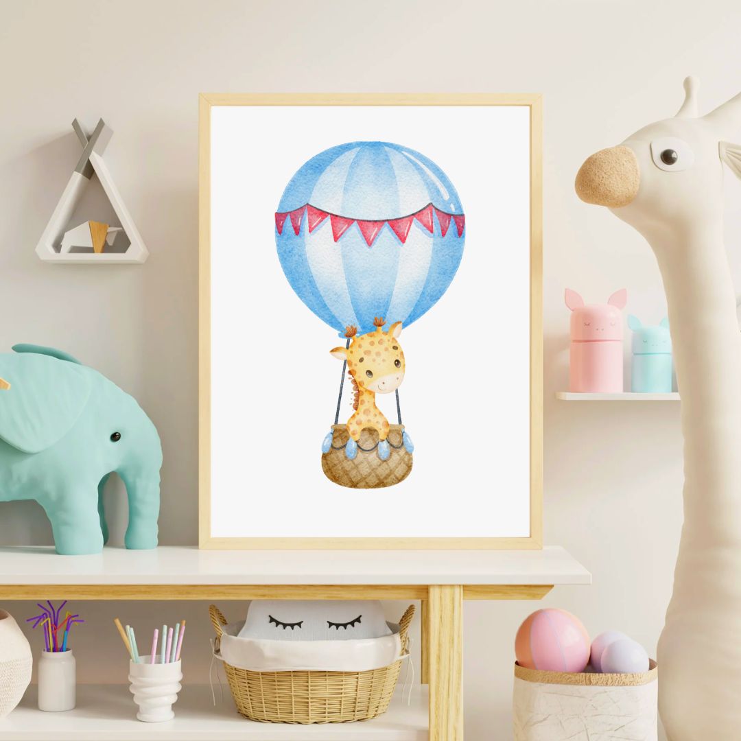 Framed artwork of a giraffe in a hot air balloon in a child's room.