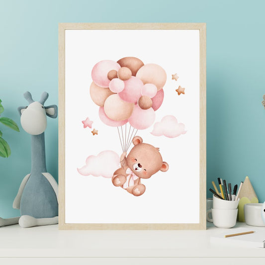 Framed artwork of a bear holding balloons on a wall with a toy and stationery items below.
