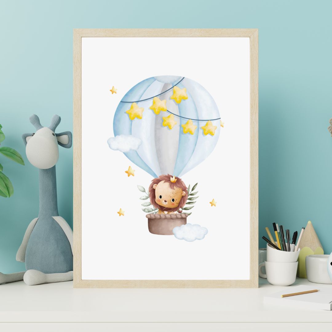 Framed artwork of a lion in a hot air balloon with stars, on a light blue wall with a stuffed giraffe.