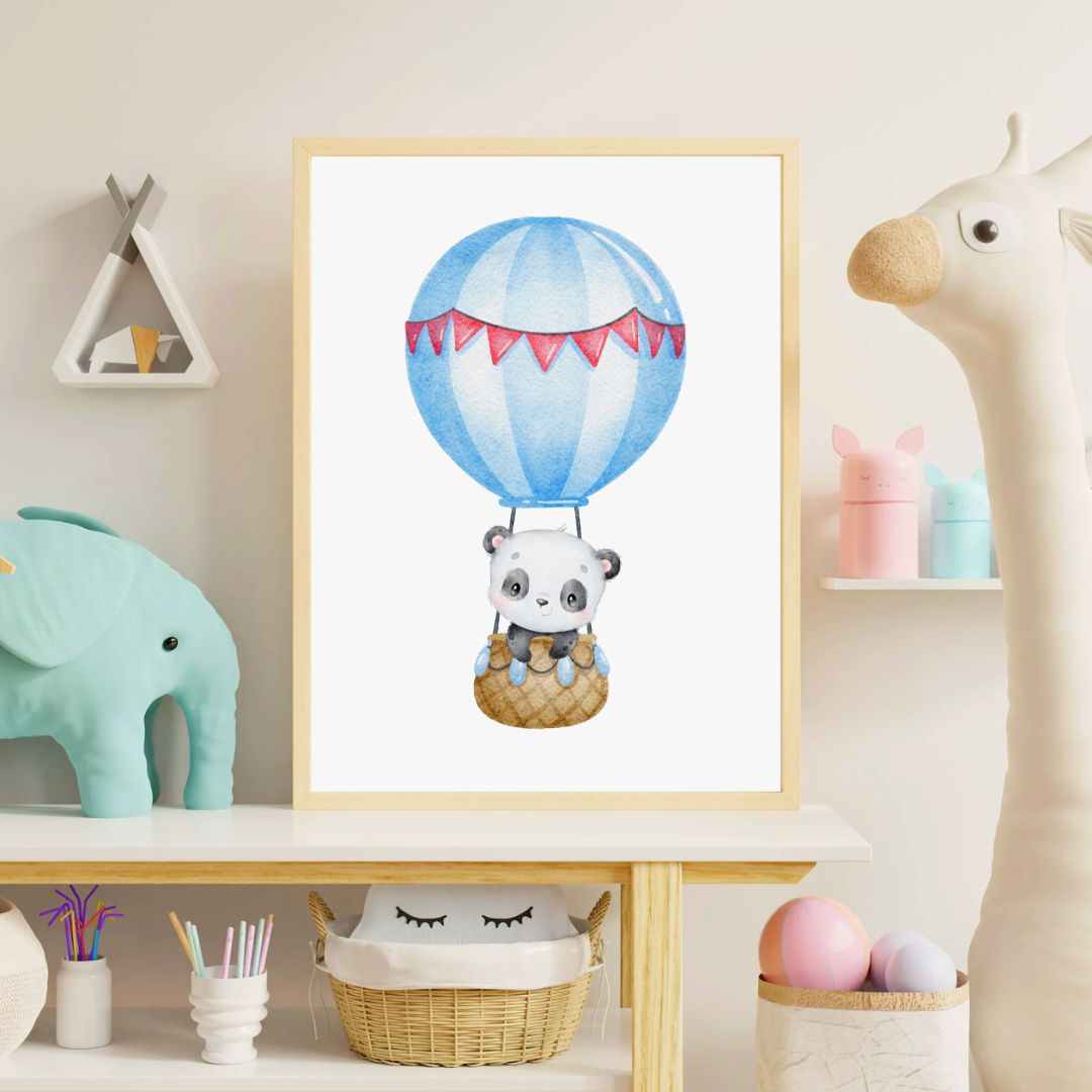 Framed artwork of a panda in a hot air balloon in a child's room.
