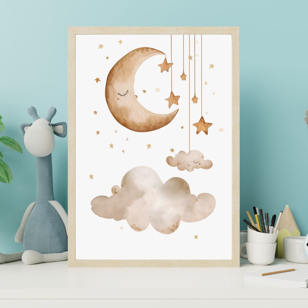 Framed artwork with a moon, cloud, and stars on a wall in a child's room.