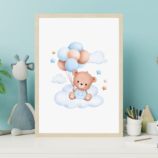 Framed artwork of a teddy bear with balloons on a cloud, placed on a shelf with a blue wall background.