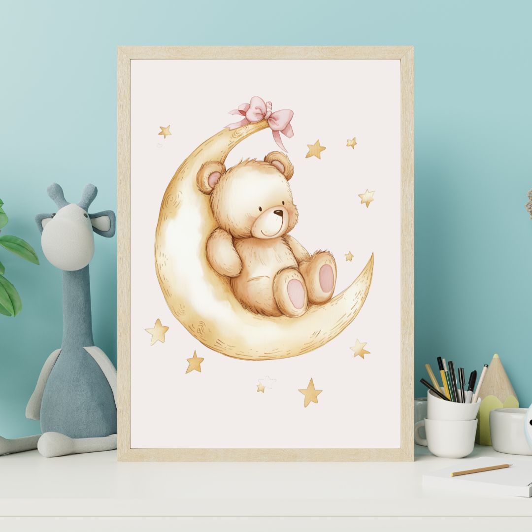 Framed artwork of a teddy bear on a moon with stars, displayed on a shelf against a light blue wall.