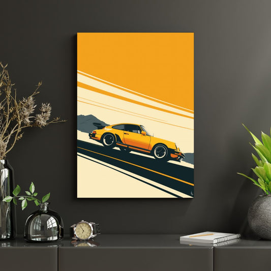 Framed artwork of a yellow sports car on a road against an orange background, displayed on a dark surface with decorative items.