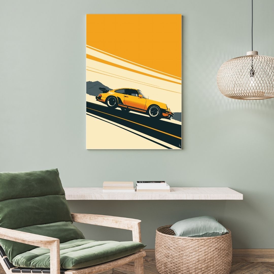 Living room with a green armchair, wicker side table, and a painting of a yellow sports car on the wall.